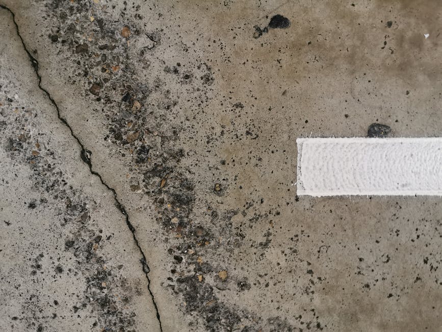 Concrete crack close-up showing width and depth